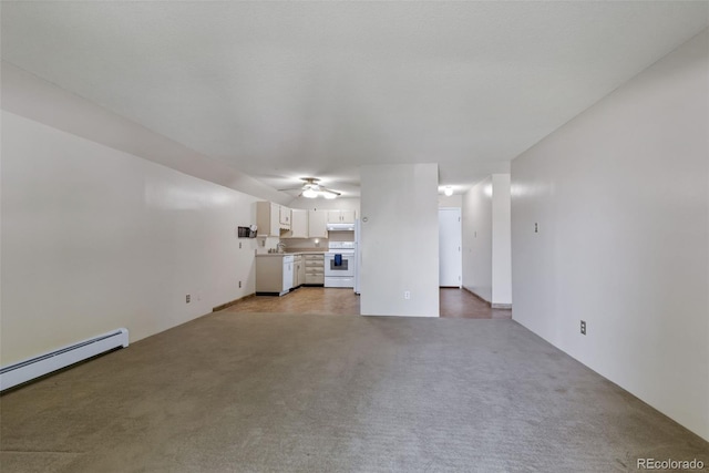 13606 E Bates Ave Unit 102, Aurora, CO 80014 - unfurnished living room featuring a baseboard heating unit, light carpet, and a ceiling fan