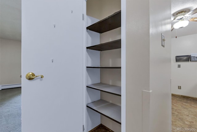 13606 E Bates Ave Unit 102, Aurora, CO 80014 - closet with a baseboard radiator