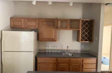 kitchen with white fridge and sink