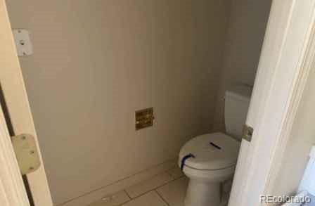 bathroom featuring tile patterned floors and toilet