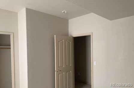 unfurnished bedroom with a closet