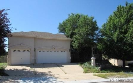 view of front of property featuring a garage