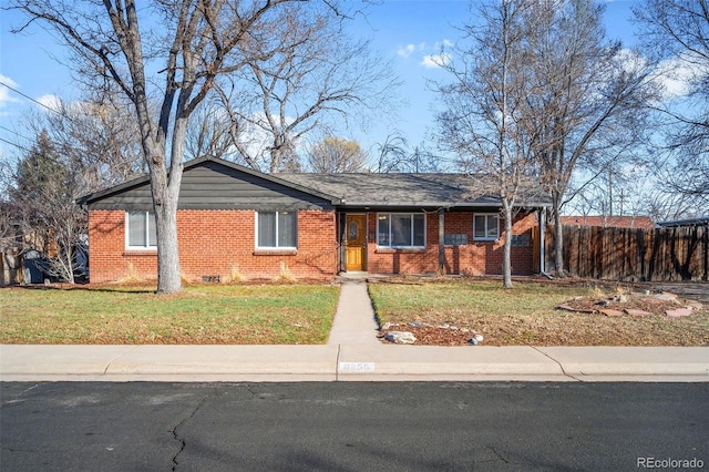 ranch-style home featuring a front yard