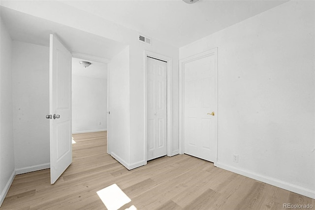 5112 Duluth Ct, Denver, CO 80239 - unfurnished bedroom with light wood-type flooring and a closet