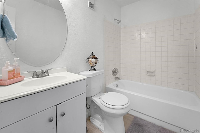 5112 Duluth Ct, Denver, CO 80239 - full bathroom with vanity, bathtub / shower combination, wood finished floors, and a textured wall