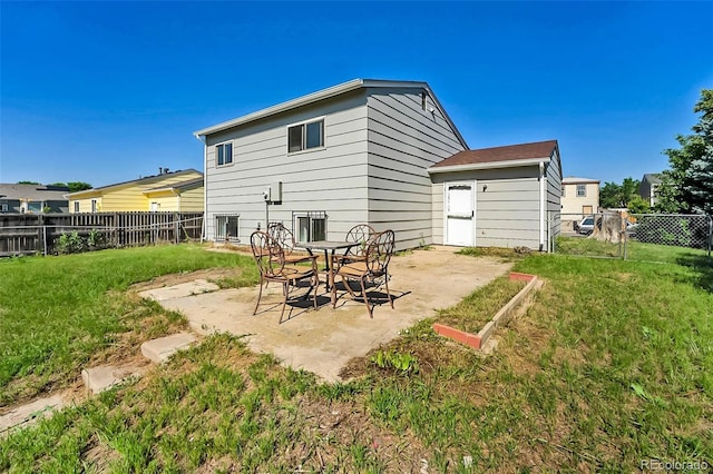 5112 Duluth Ct, Denver, CO 80239 - rear view of house with a patio and a fenced backyard