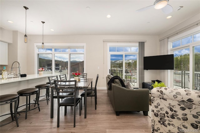 78321 US Highway 40 # 25, Winter Park, CO 80482 - dining room with light wood finished floors, a ceiling fan, recessed lighting, and baseboards