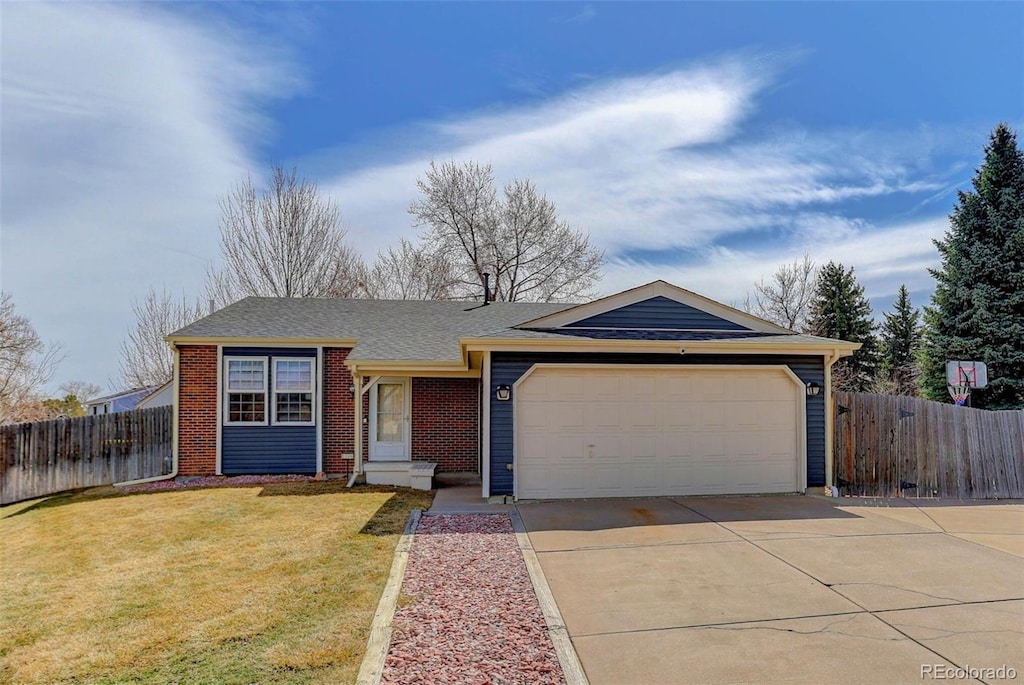 single story home with brick siding, a front lawn, fence, a garage, and driveway