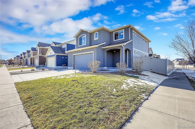 view of front property featuring a front yard and a garage