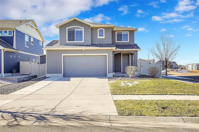 view of front property with a garage and a front lawn