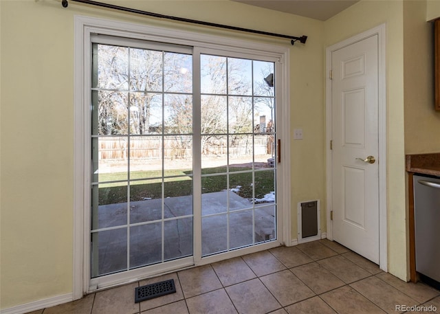 entryway featuring light tile patterned floors