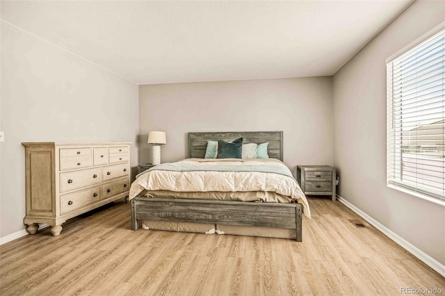 bedroom with light hardwood / wood-style floors