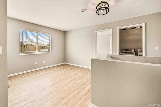 spare room with light wood-type flooring