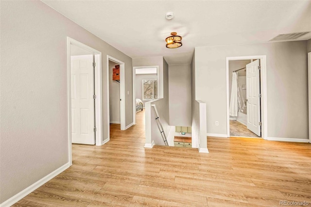 hallway featuring light wood-type flooring