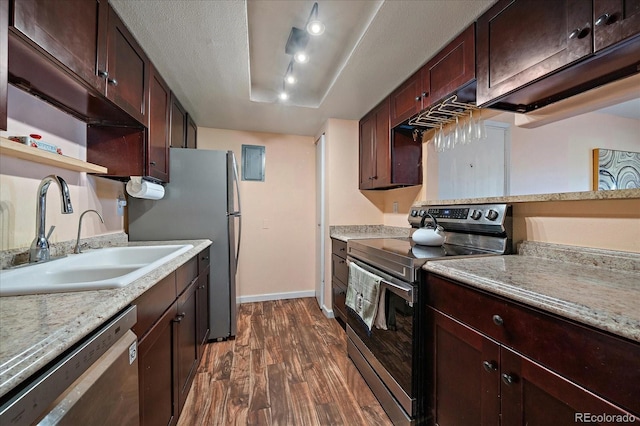 13393 E Asbury Dr Unit 103, Aurora, CO 80014 - kitchen with stainless steel appliances, dark wood finished floors, open shelves, and dark brown cabinetry