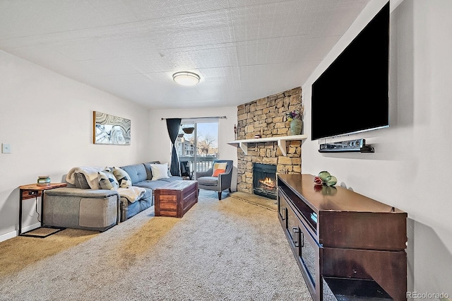 13393 E Asbury Dr Unit 103, Aurora, CO 80014 - living area with carpet flooring and a stone fireplace