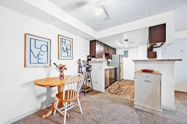 13393 E Asbury Dr Unit 103, Aurora, CO 80014 - kitchen featuring appliances with stainless steel finishes, a ceiling fan, light countertops, dark brown cabinets, and light carpet
