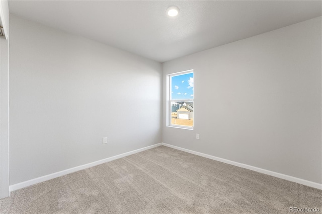 unfurnished room featuring carpet floors