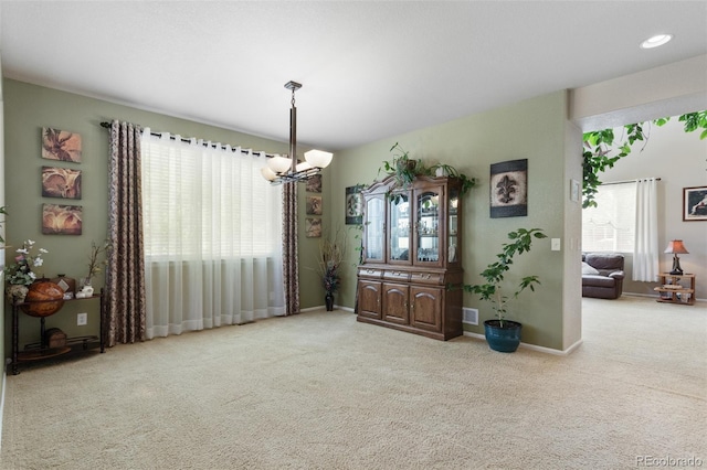13415 Kearney St, Thornton, CO 80602 - dining room featuring carpet, a chandelier, and baseboards