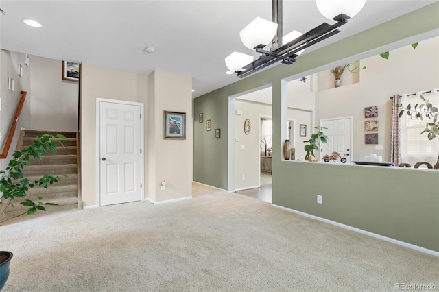13415 Kearney St, Thornton, CO 80602 - unfurnished living room featuring carpet floors, stairway, baseboards, and recessed lighting