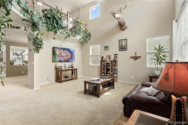 13415 Kearney St, Thornton, CO 80602 - carpeted living area with a towering ceiling and baseboards