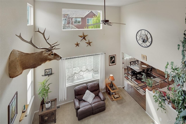 13415 Kearney St, Thornton, CO 80602 - living area with ceiling fan, healthy amount of natural light, carpet floors, and a high ceiling