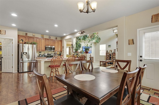 13415 Kearney St, Thornton, CO 80602 - dining room with recessed lighting, a chandelier, and wood finished floors