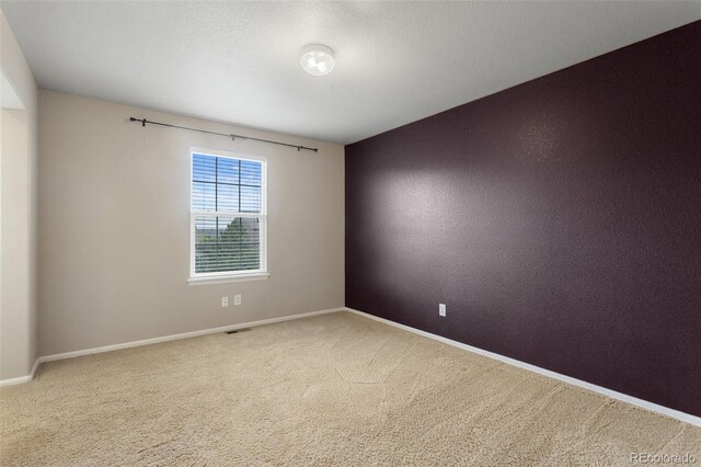 13415 Kearney St, Thornton, CO 80602 - carpeted empty room with baseboards