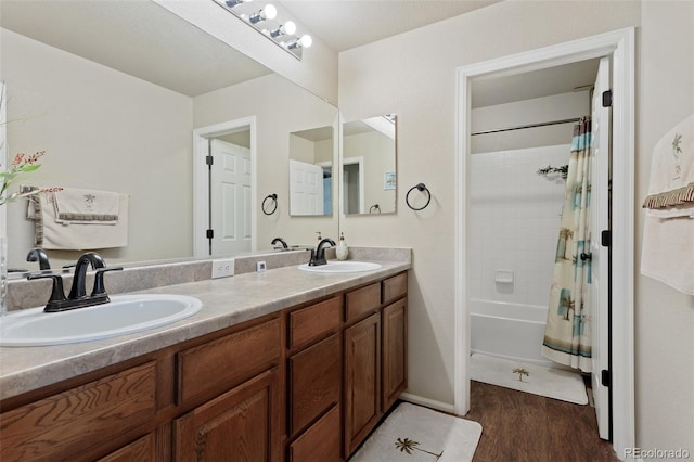 13415 Kearney St, Thornton, CO 80602 - bathroom with wood finished floors, double vanity, and shower / bath combination with curtain