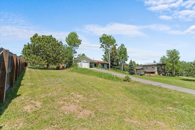 8427 S Custer Ln, Evergreen, CO 80439 - view of yard featuring driveway and an attached garage