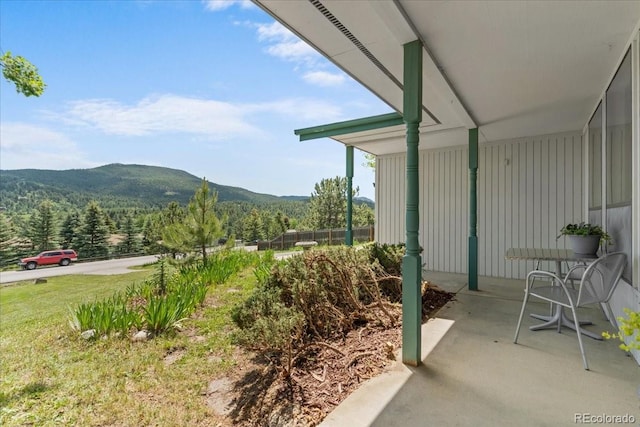 8427 S Custer Ln, Evergreen, CO 80439 - view of mountain background featuring a heavily wooded area