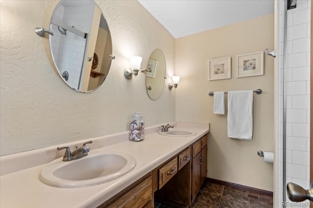 8427 S Custer Ln, Evergreen, CO 80439 - full bathroom with double vanity and a textured wall