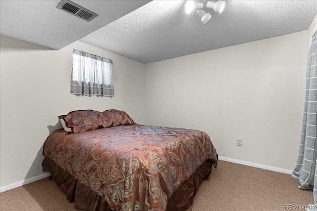 8427 S Custer Ln, Evergreen, CO 80439 - carpeted bedroom featuring baseboards and a textured ceiling