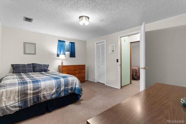 8427 S Custer Ln, Evergreen, CO 80439 - carpeted bedroom with a textured ceiling and a closet