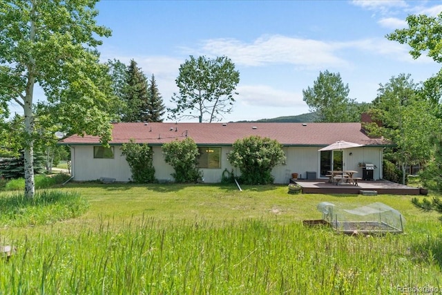8427 S Custer Ln, Evergreen, CO 80439 - back of house with a deck and a yard