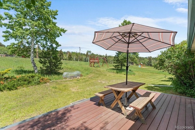 8427 S Custer Ln, Evergreen, CO 80439 - wooden terrace with a playground, a yard, and outdoor dining area