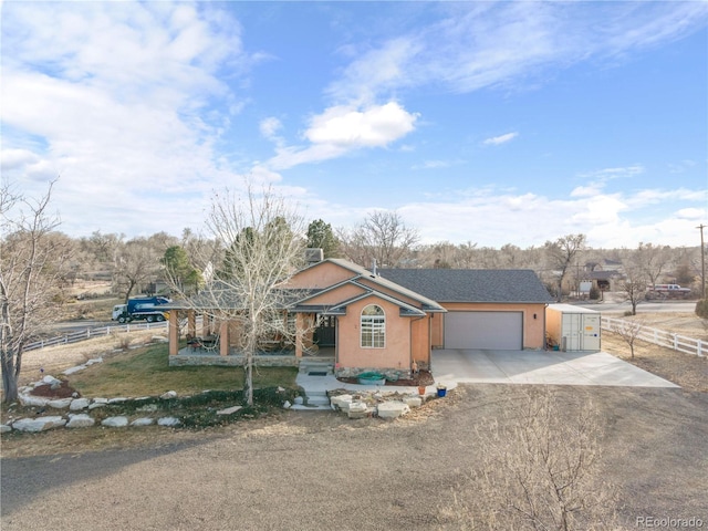 ranch-style house featuring a garage and a front lawn