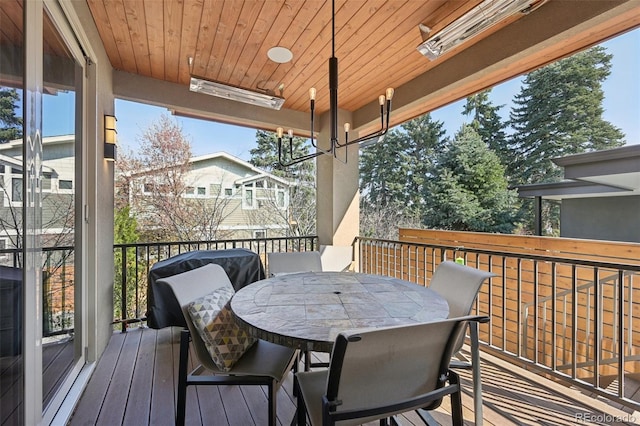 wooden terrace featuring outdoor dining area