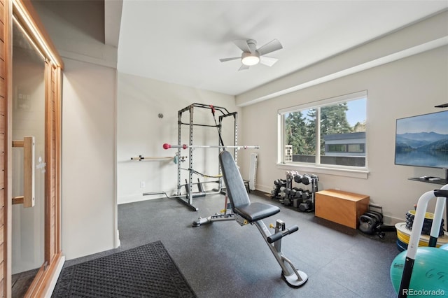 exercise room with a ceiling fan