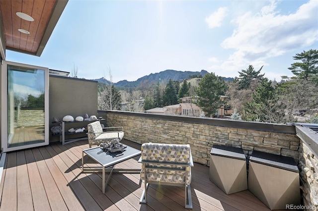 wooden deck featuring a mountain view
