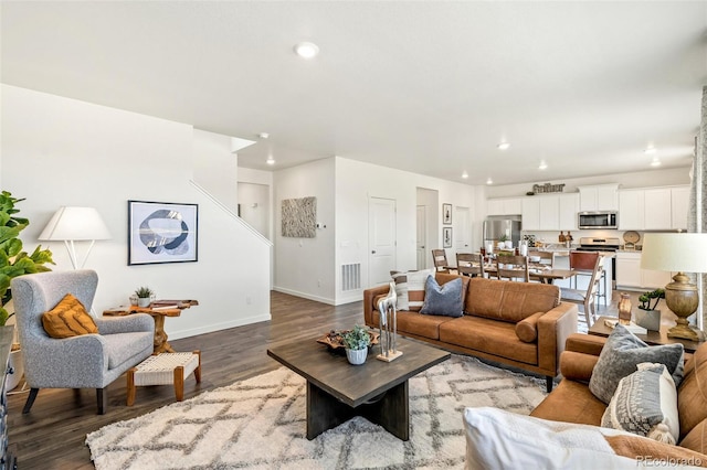 living room featuring dark wood-type flooring