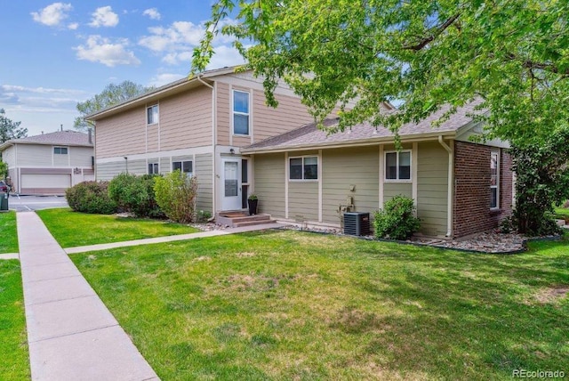 6650 E Arizona Ave Unit 154, Denver, CO 80224 - rear view of house with a yard and brick siding