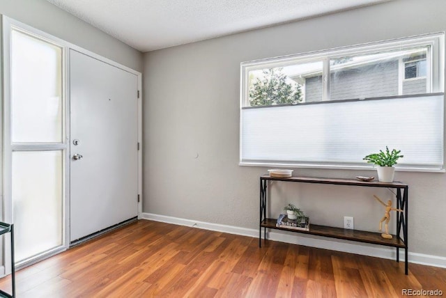 6650 E Arizona Ave Unit 154, Denver, CO 80224 - foyer entrance with wood finished floors and baseboards