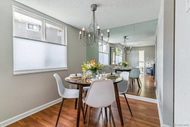 6650 E Arizona Ave Unit 154, Denver, CO 80224 - dining room with a chandelier, a textured ceiling, plenty of natural light, wood finished floors, and a textured wall
