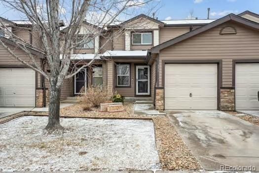 view of front of property featuring an attached garage, driveway, and entry steps