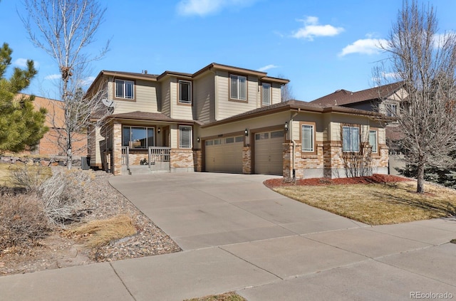 prairie-style home featuring an attached garage, a porch, and concrete driveway