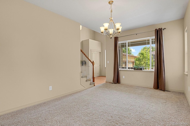 24269 E Arapahoe Pl, Aurora, CO 80016 - carpeted spare room featuring a chandelier and stairway