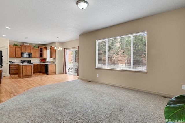 24269 E Arapahoe Pl, Aurora, CO 80016 - living area featuring a chandelier, light carpet, and recessed lighting