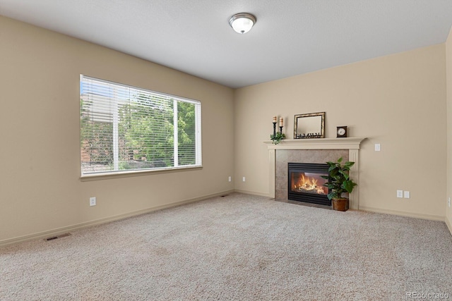24269 E Arapahoe Pl, Aurora, CO 80016 - unfurnished living room featuring a fireplace and carpet flooring