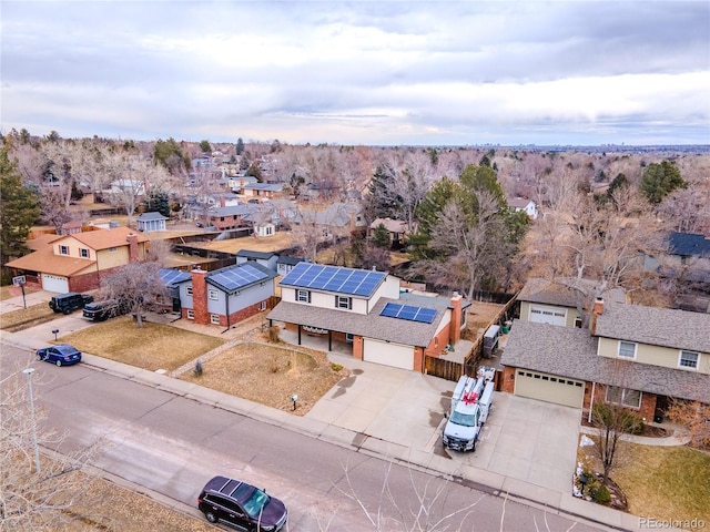 birds eye view of property with a residential view